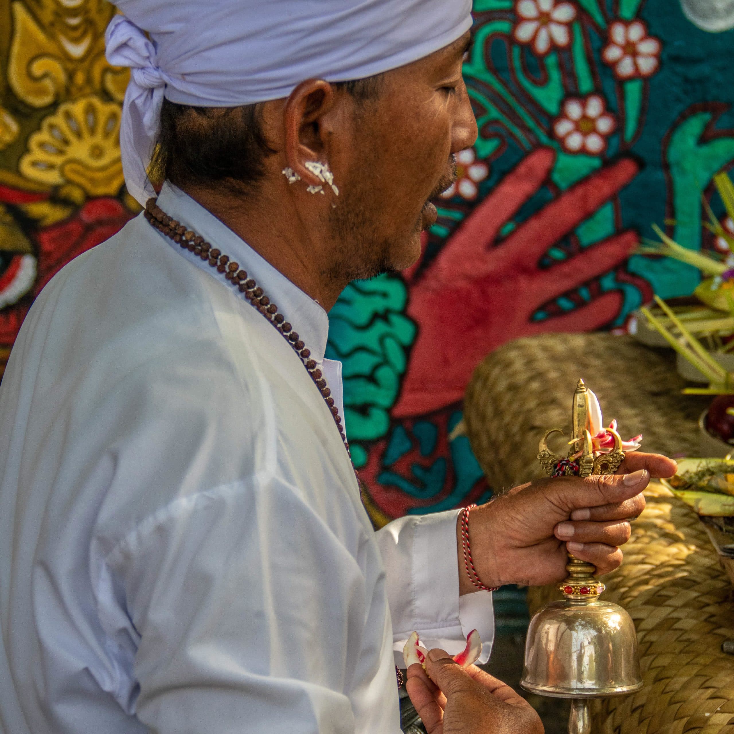 Priest performing a ceremony at Padang Padang Surf Camp