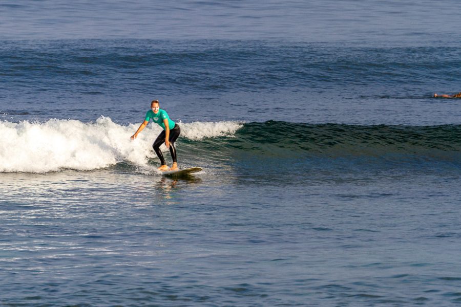 Beginner surfer riding a wave.