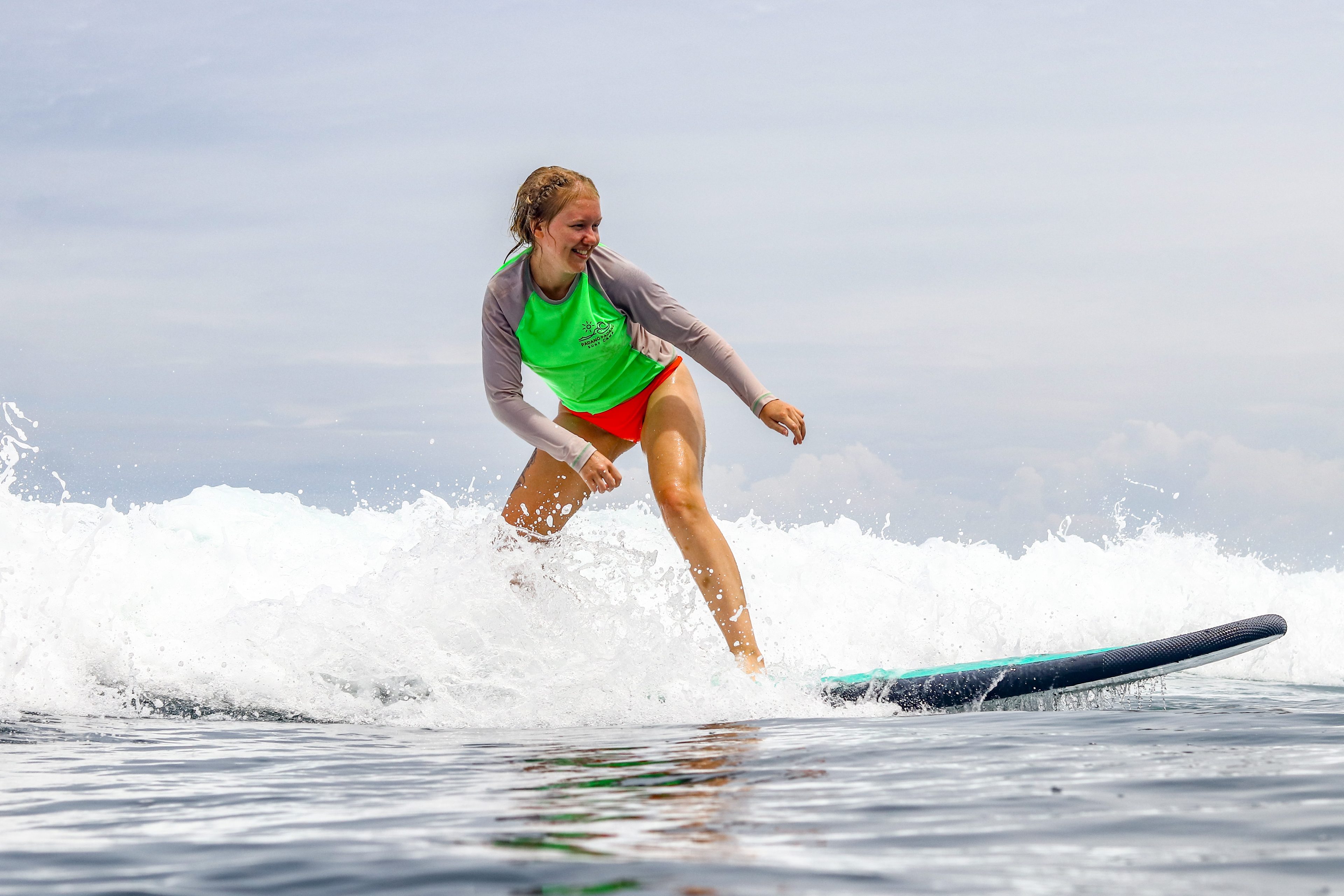 Beginner surfer riding a wave.