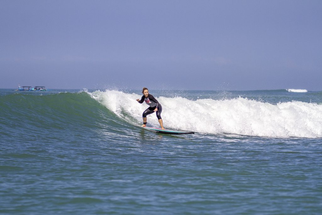 Beginner surfer at Tower surf spot in Jimbaran Bay