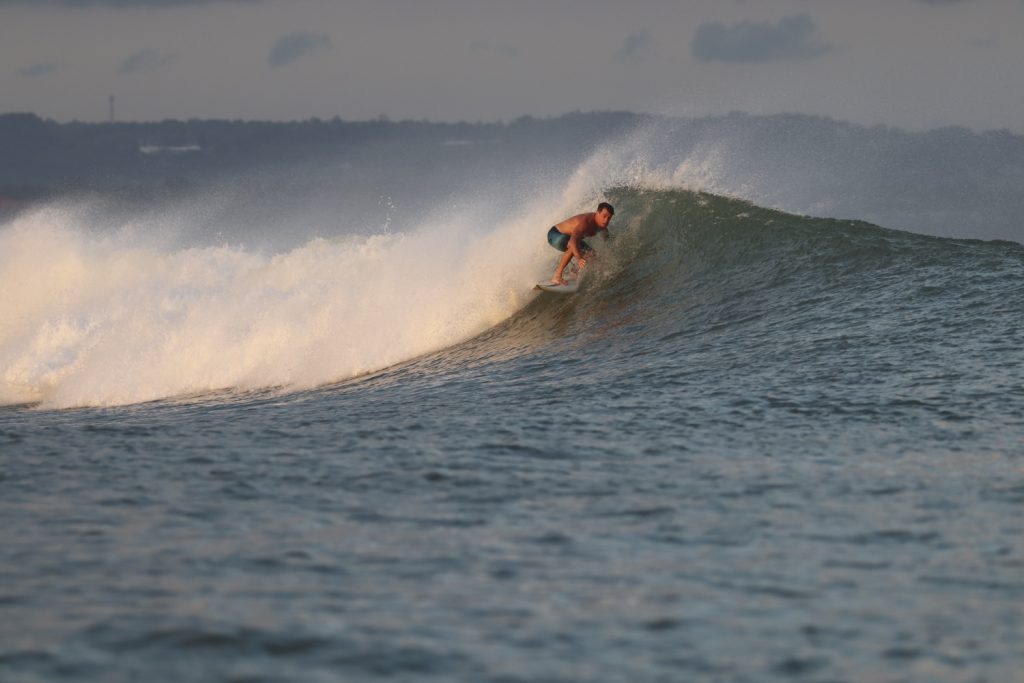 Surfing a wave at Airport lefts