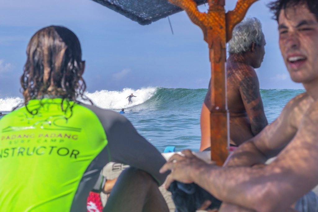 View of surfer at Kuta Reef from the boat