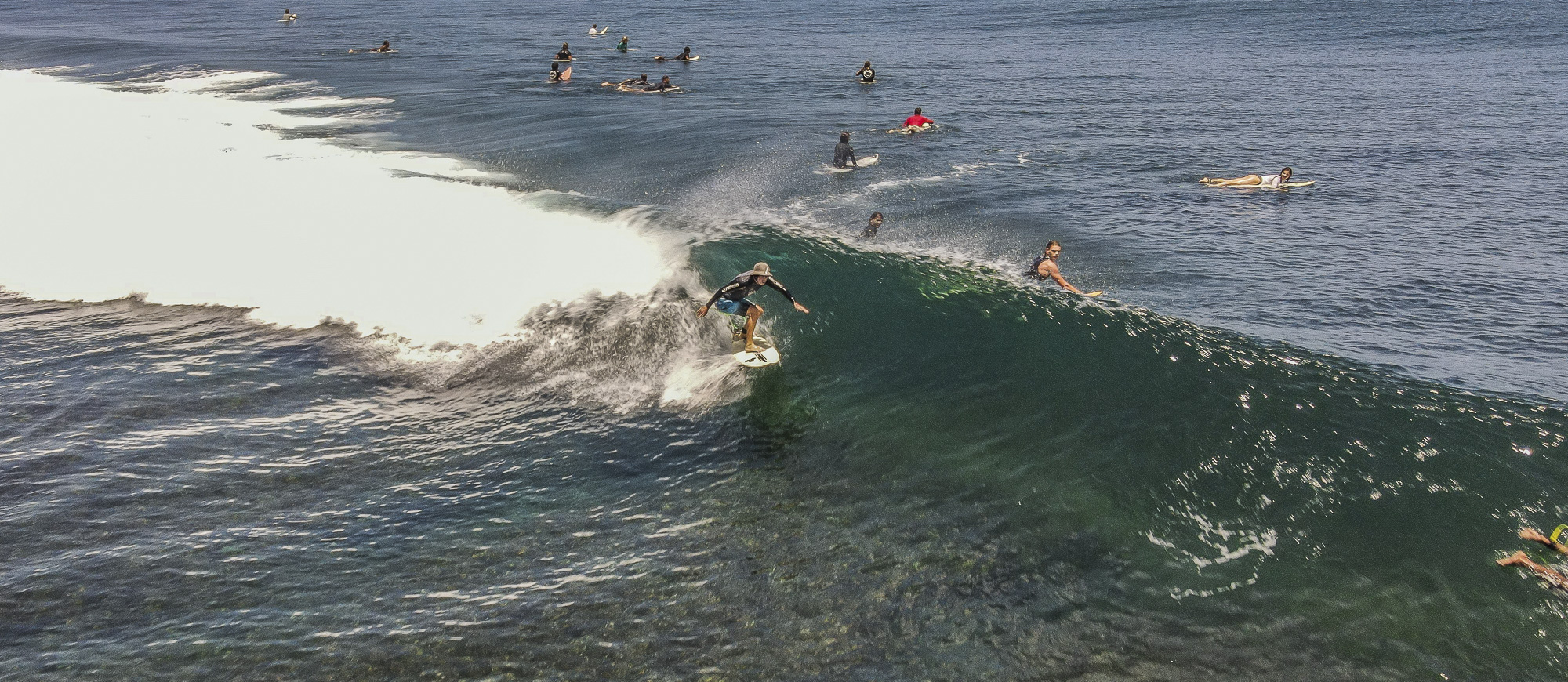 Surfing riding a wave at Uluwatu